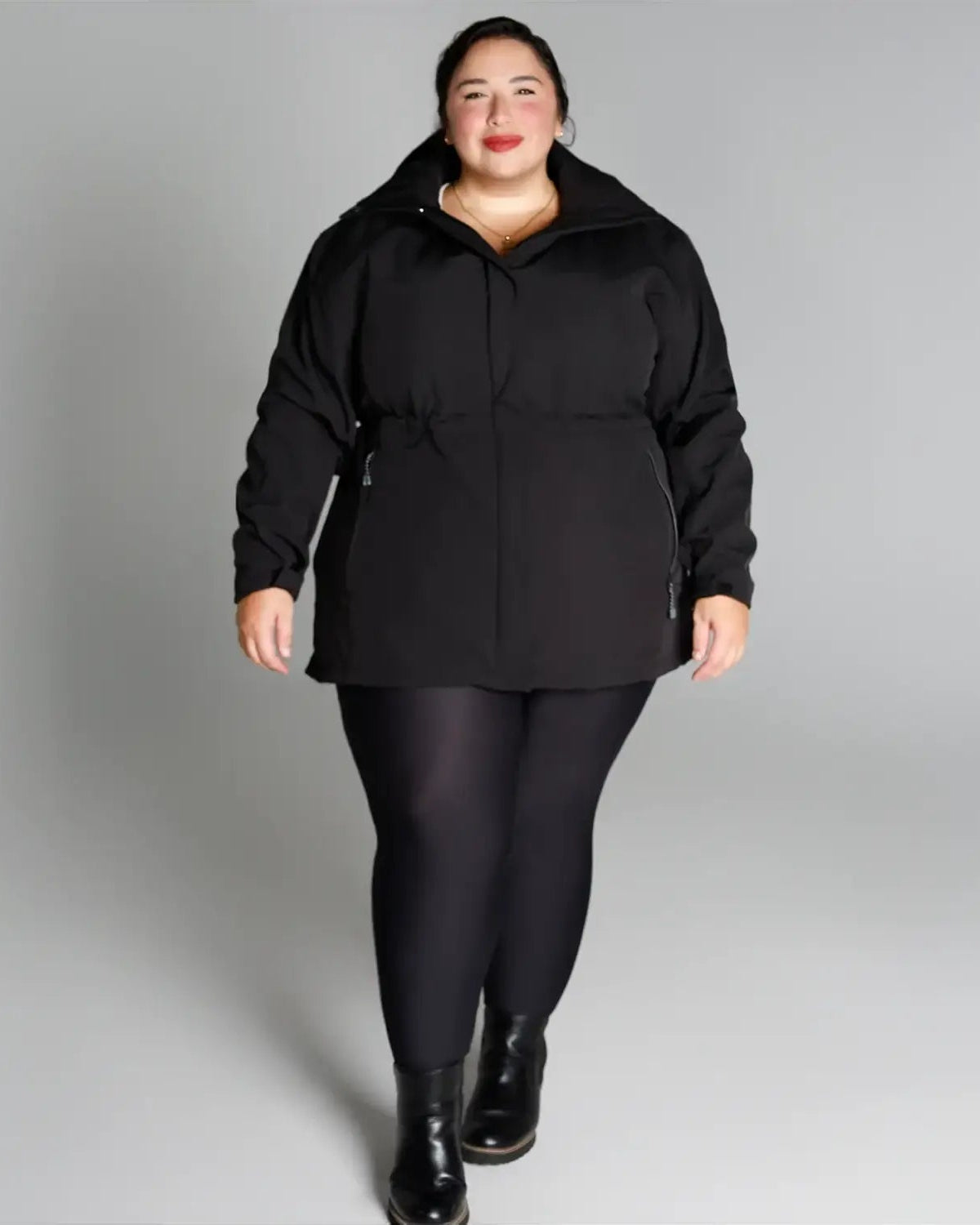 Plus size women wearing black jacket and leggings outfit featuring Stowe Mid Length Soft Shell Jacket