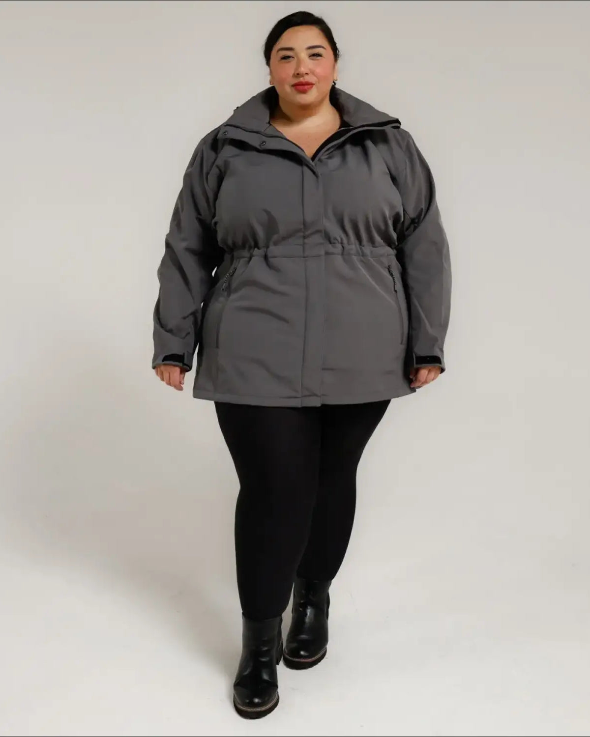 Woman wearing a gray plus size Stowe Mid Length Soft Shell Jacket