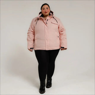 Woman in pink puffer jacket wearing Women’s Plus Size Insulated Snowboard Ski Coat