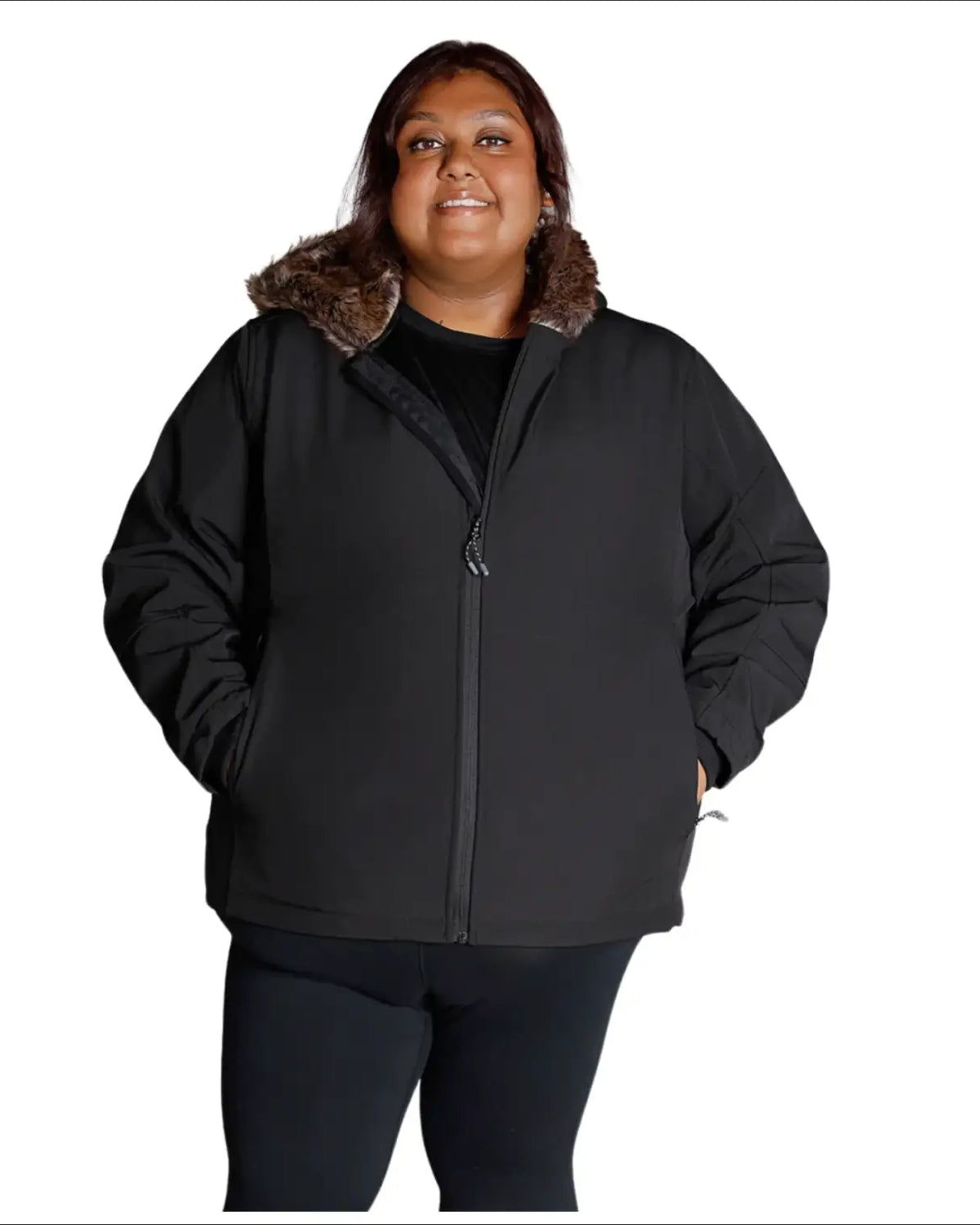 Woman wearing a black plus size faux fur soft shell jacket in fall or spring weather