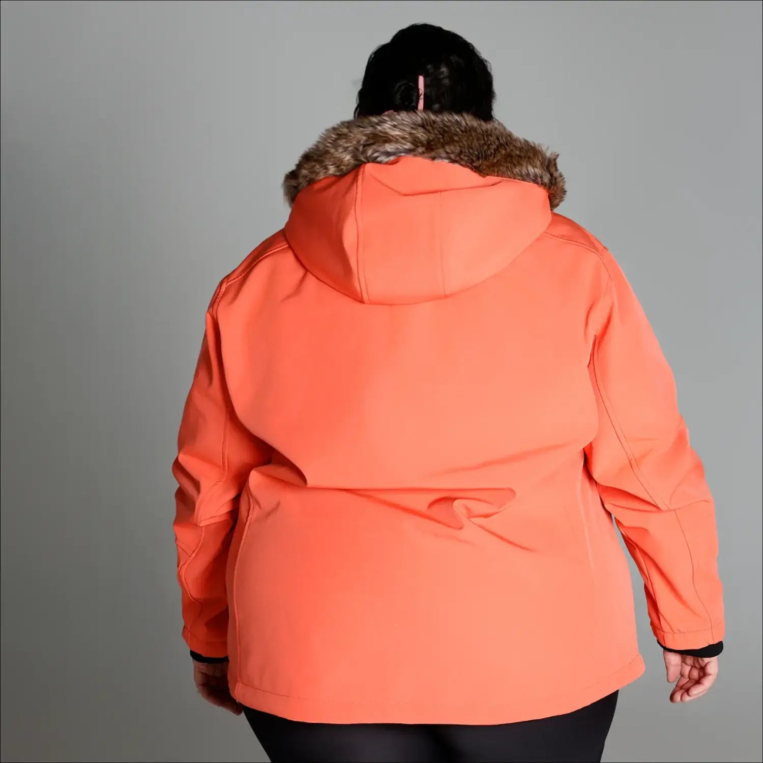 Orange parka with fur-trimmed hood from Women’s Plus Size Alta Faux Fur Soft Shell Jacket