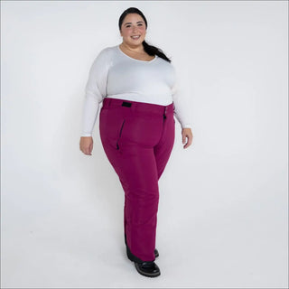 Woman wearing magenta Snow Country Outerwear insulated ski pants for plus size women