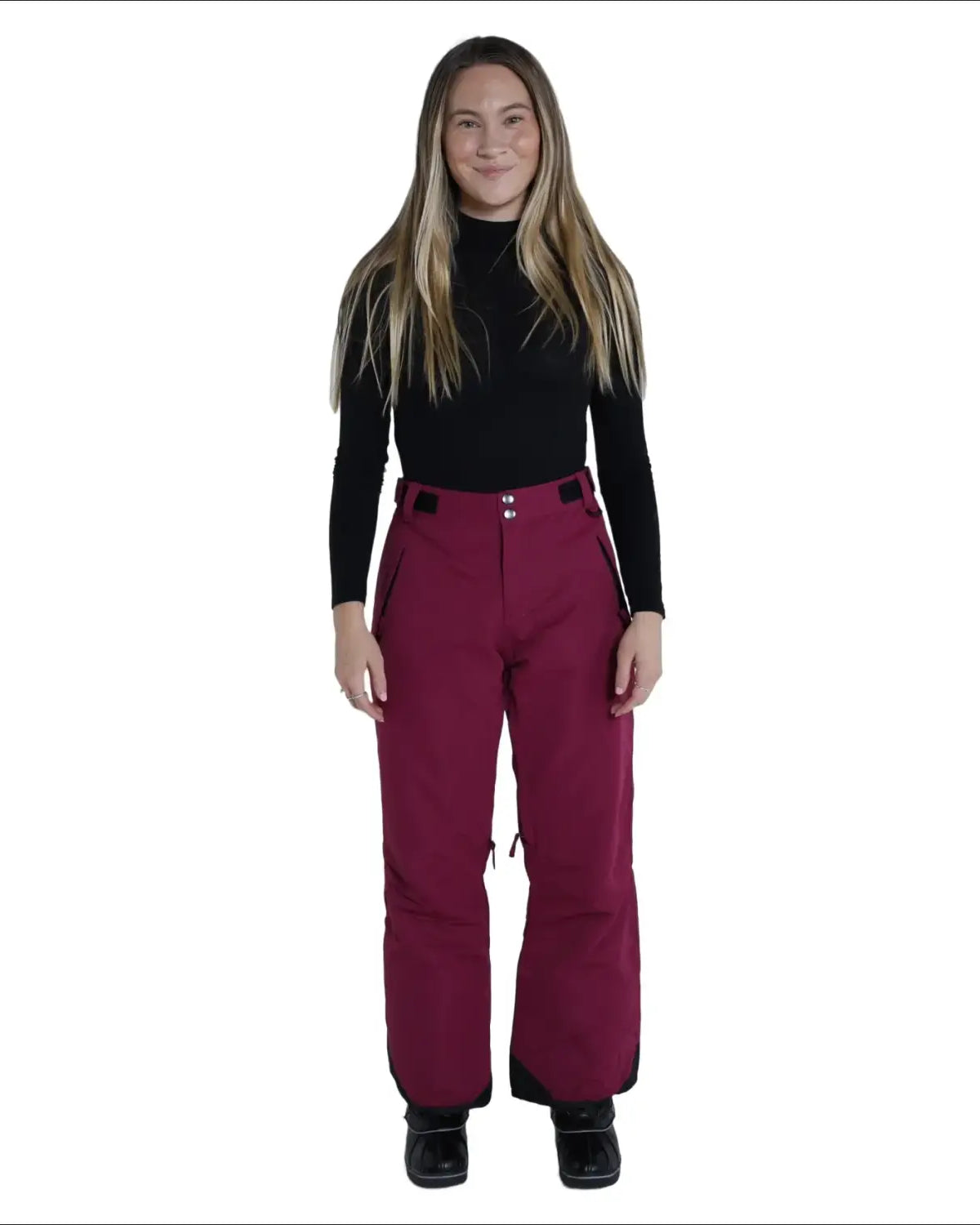 Woman wearing maroon Snow Country Outerwear women’s ski pants for snowboarding