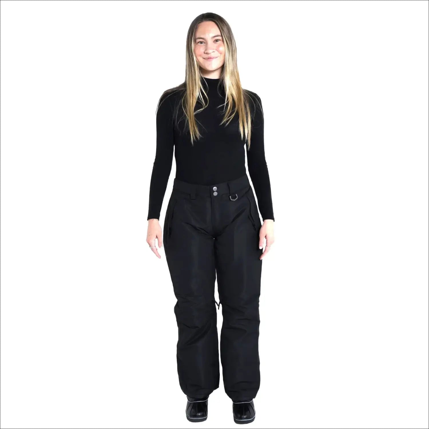 Woman in black turtleneck and snow pants wearing Snow Country Women’s Ski Pants