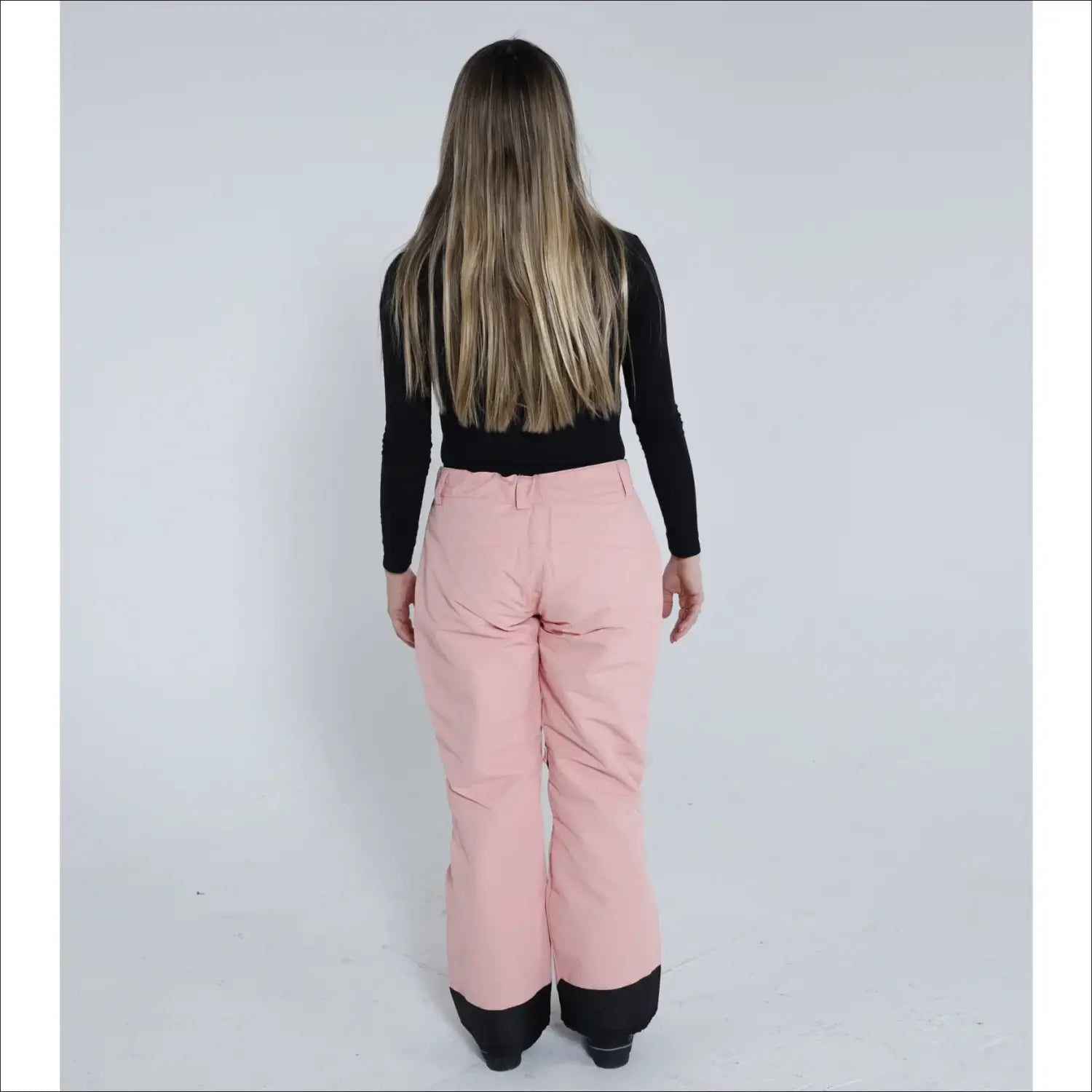 Pink snow pants with black cuffs from Snow Country Outerwear Women’s Ski Pants collection