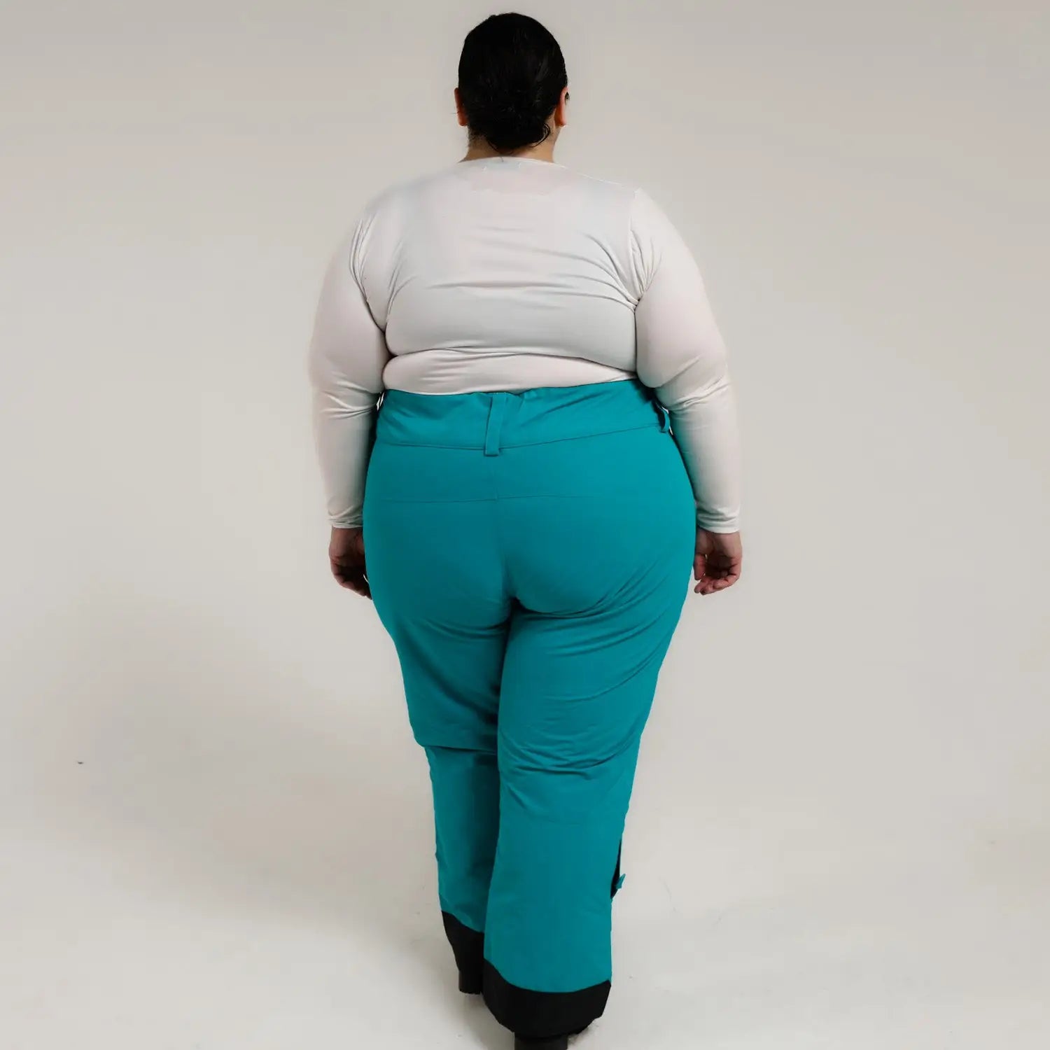 Teal snow pants from Snow Country Outerwear for women with plus sizes and insulated design