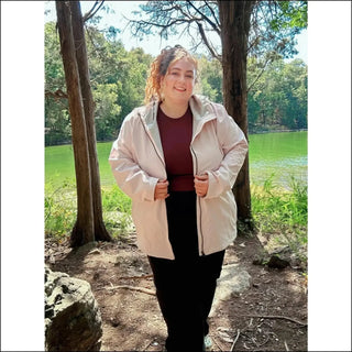 Woman in pink plus size waterproof rain jacket Camden spring fall windbreaker coat