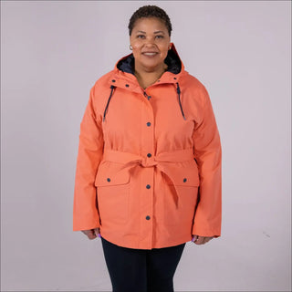Woman wearing an orange belted trench coat from Snow Country Outerwear Rain Jacket collection