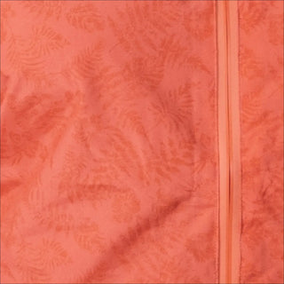 Peach-colored fabric with fern pattern and zipper on Women’s Plus Size Rain Jacket