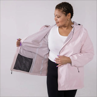 Woman wearing a pink waterproof rain jacket Camden Spring Fall plus size coat