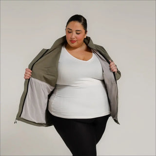 Woman wearing an open olive plus size rain jacket and windbreaker coat