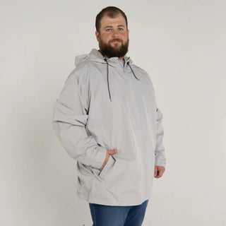 Man wearing a gray hooded anorak from Men’s Big 3XL-7XL Rain Jacket Windguard Coat