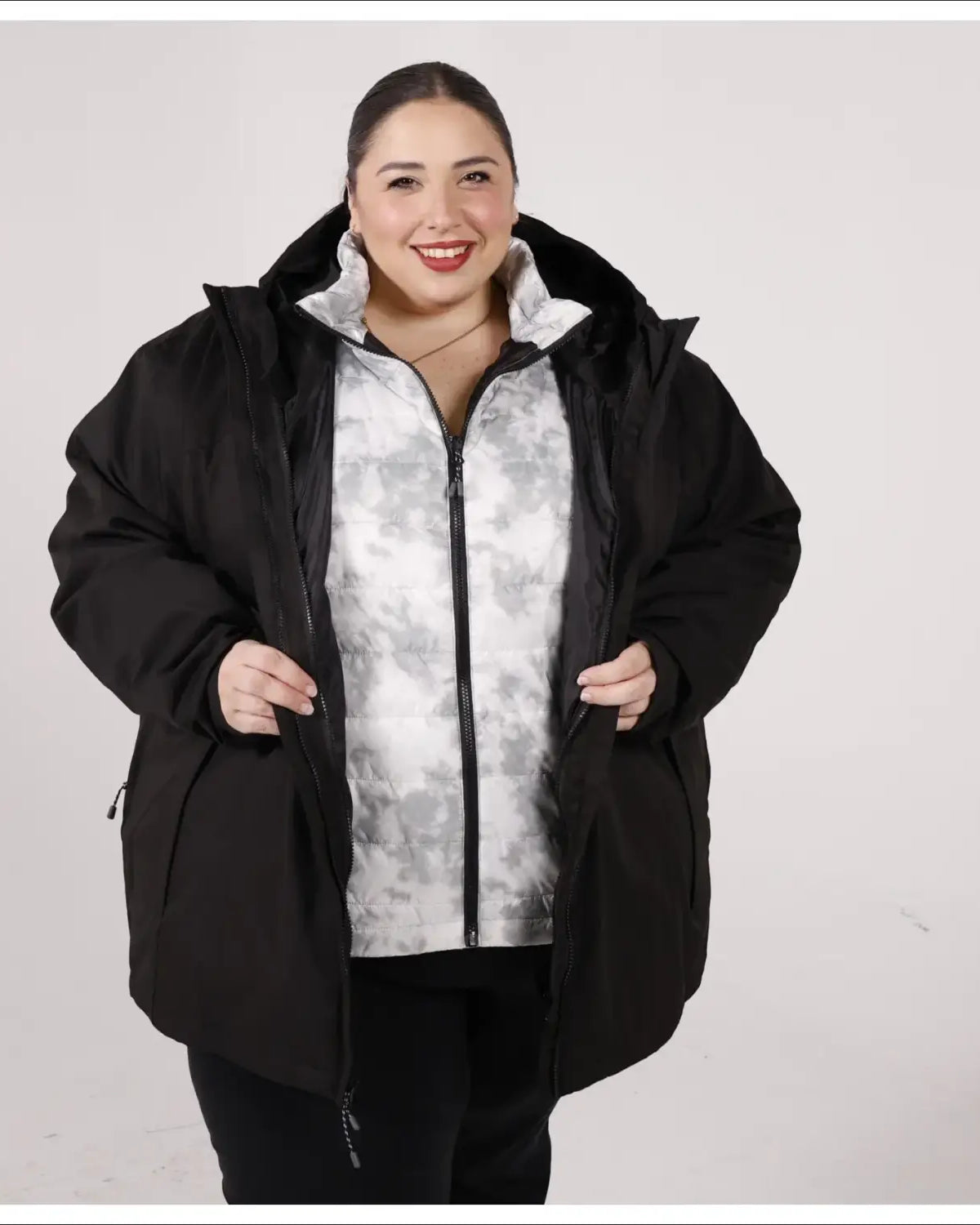 Woman in black winter coat from women’s plus size 1X-6X winter down alternative 3-in-1 jacket