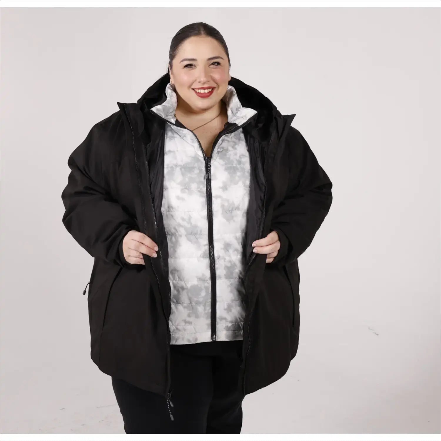 Woman in black winter coat from women’s plus size 1X-6X winter down alternative 3-in-1 jacket