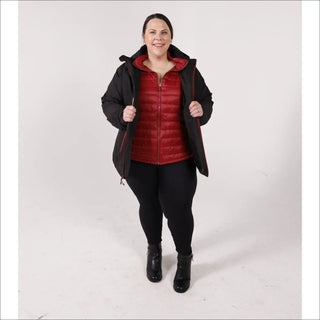 Woman in black coat and red vest wearing winter down alternative 3-in-1 jacket