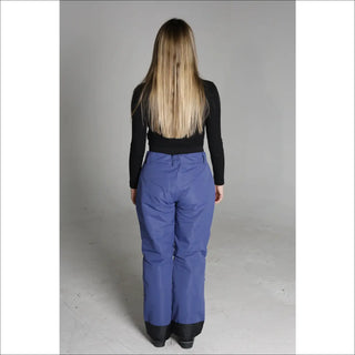 Woman wearing blue Snow Country Outerwear women’s ski pants for snowboarding