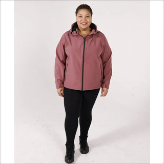 Woman wearing a mauve hooded micro fleece soft shell jacket and black leggings outdoor outerwear