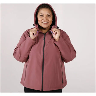 Woman wearing a mauve-colored hooded micro fleece soft shell jacket for plus size outerwear