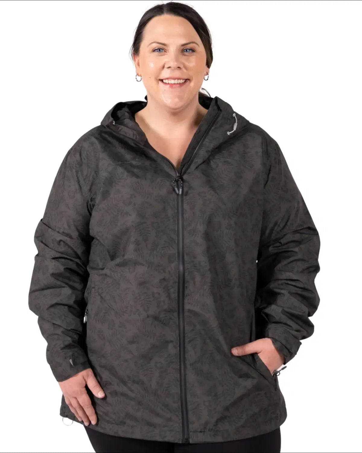 Woman wearing a plus size printed waterproof hooded rain jacket for wind protection