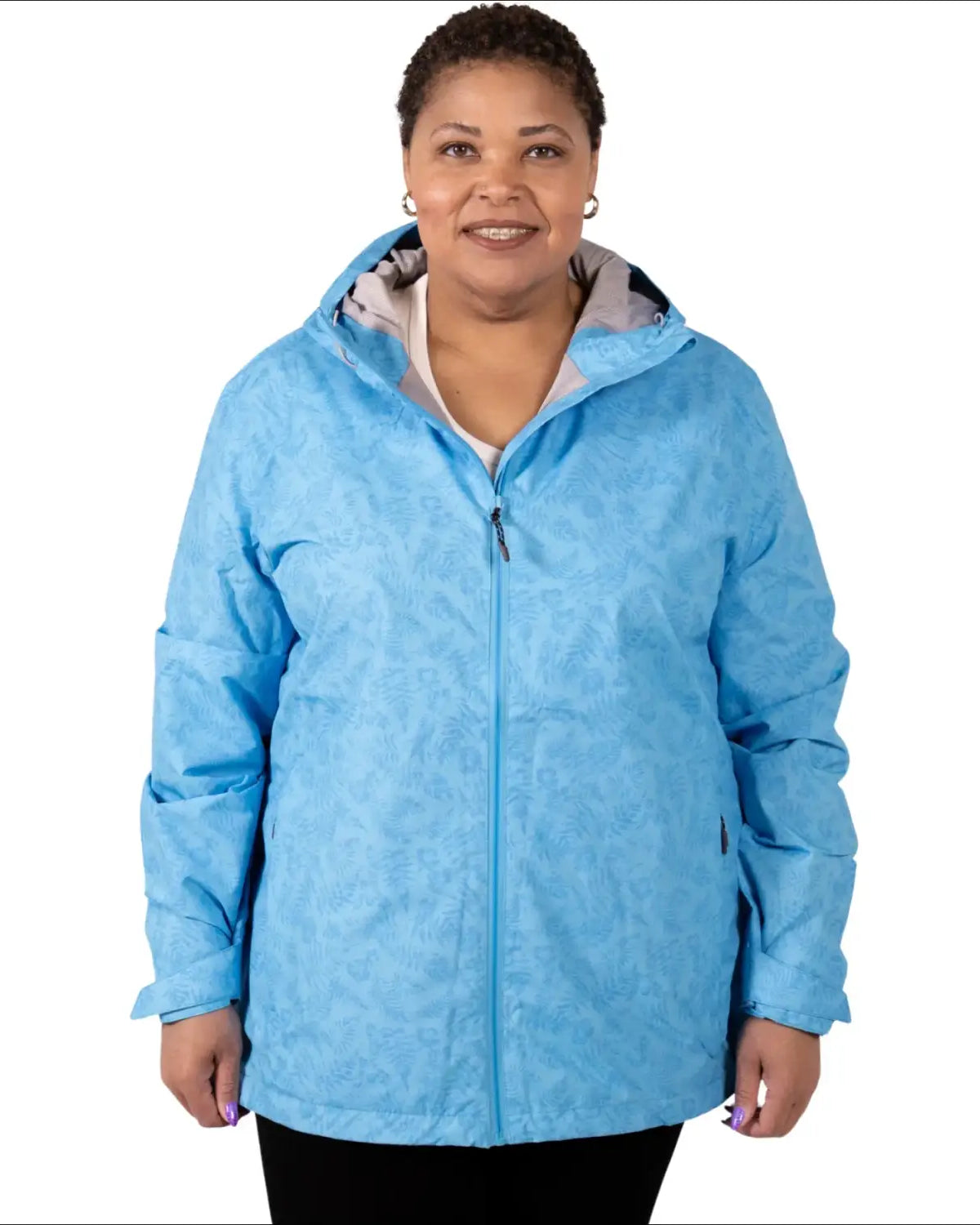 Woman wearing a light blue printed hooded waterproof plus size rain jacket