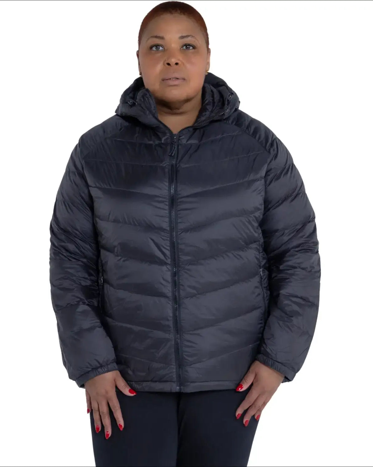 Woman wearing a hooded puffer jacket from Women’s Plus Size Packable Down Outerwear