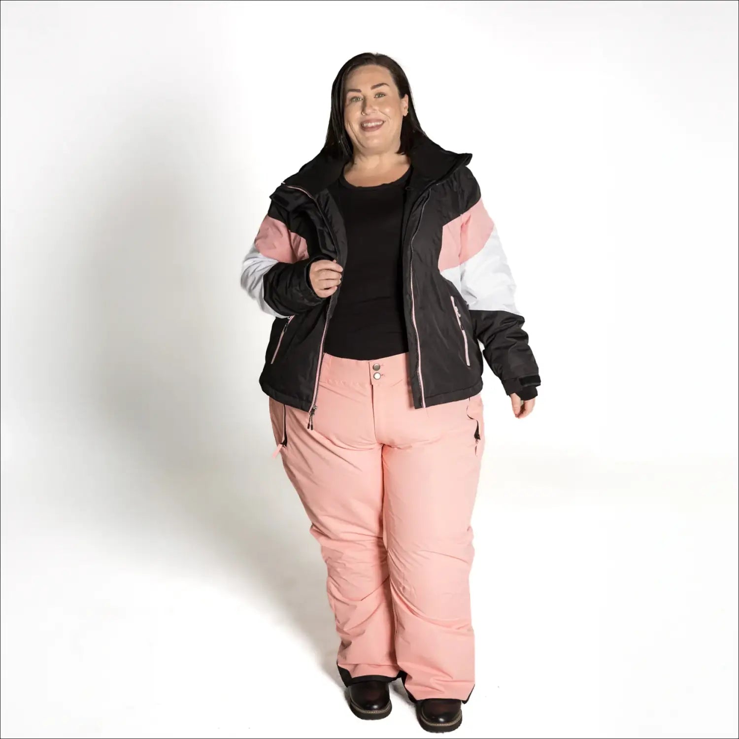 Woman wearing Snow Country Plus Size Ski Jacket and Pants for winter skiing activities