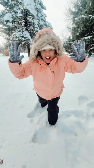 orange plus size snow jacket on a woman