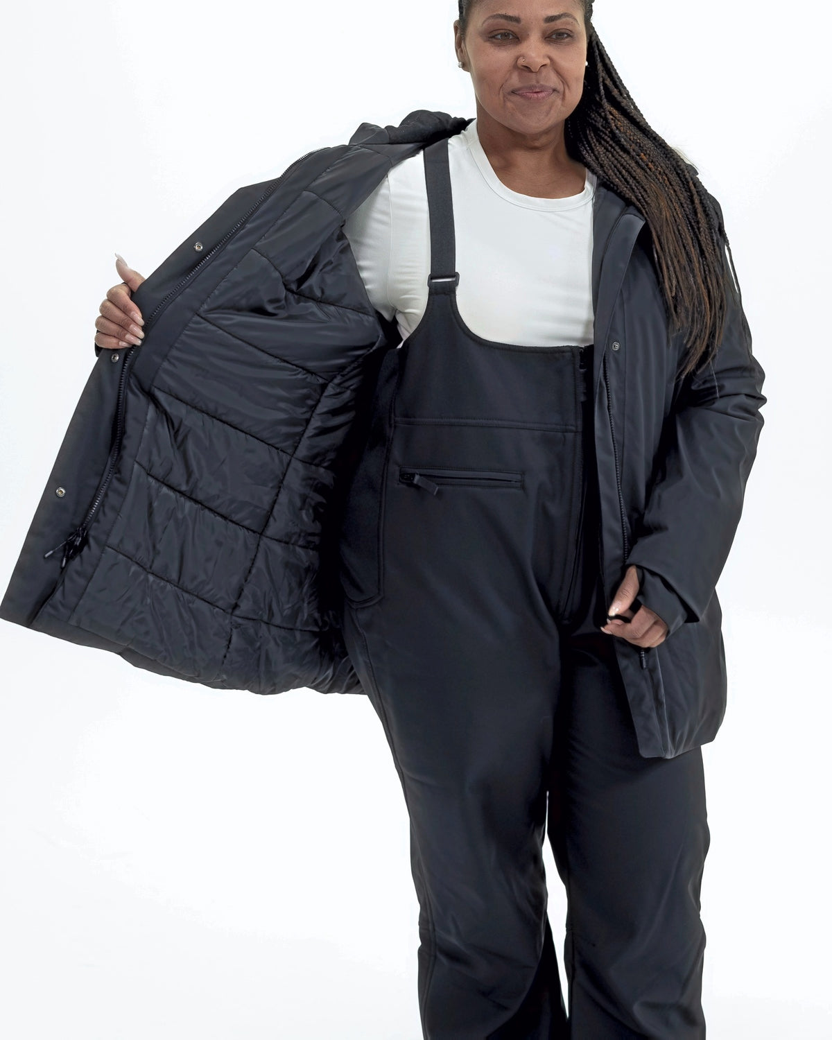 Black Cortina women's plus size insulated parka, worn open showing the quilted lining | Model is 5'6" and wears a 1X