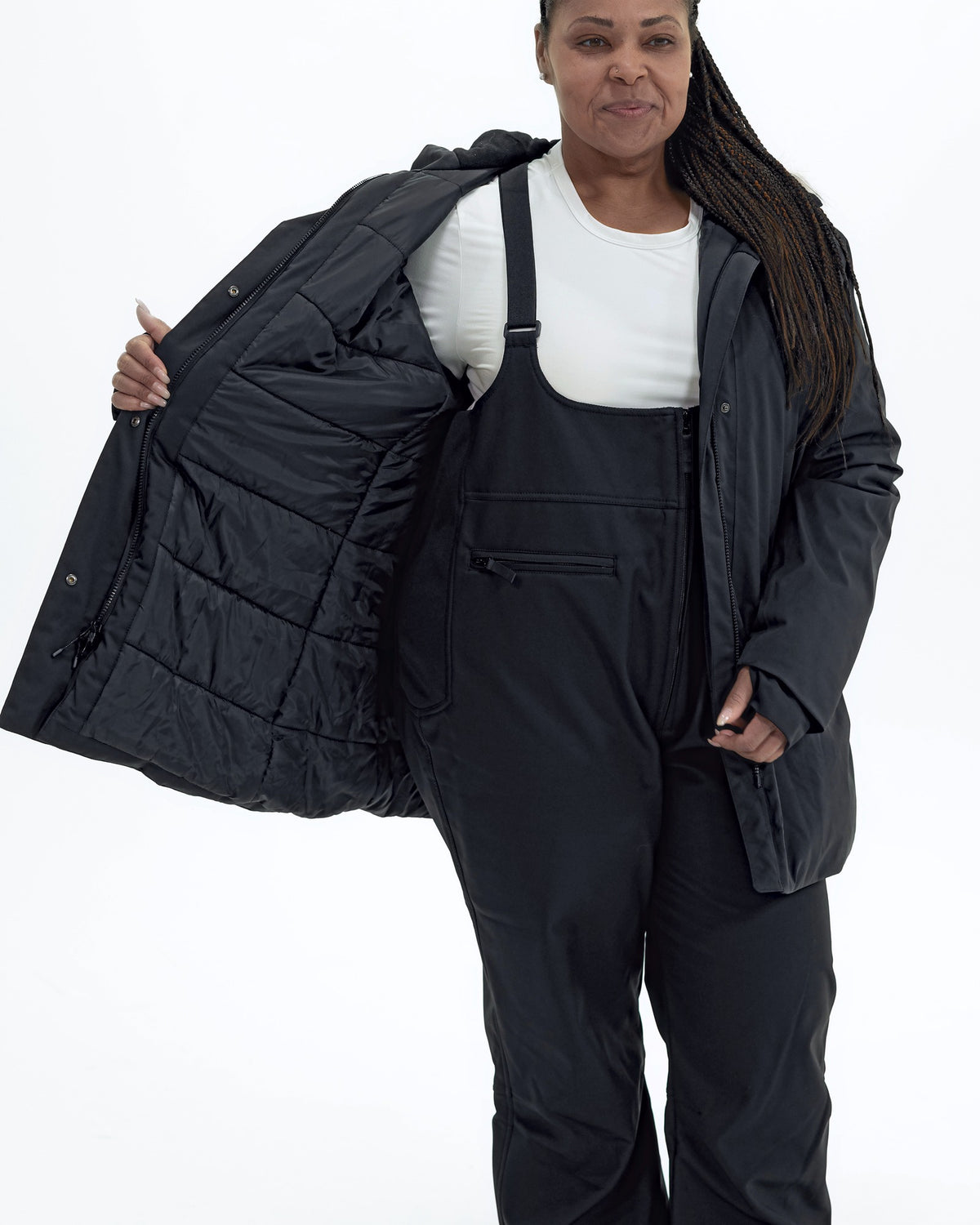 Black Cortina women's plus size insulated parka, worn open showing the quilted lining | Model is 5'6" and wears a 1X