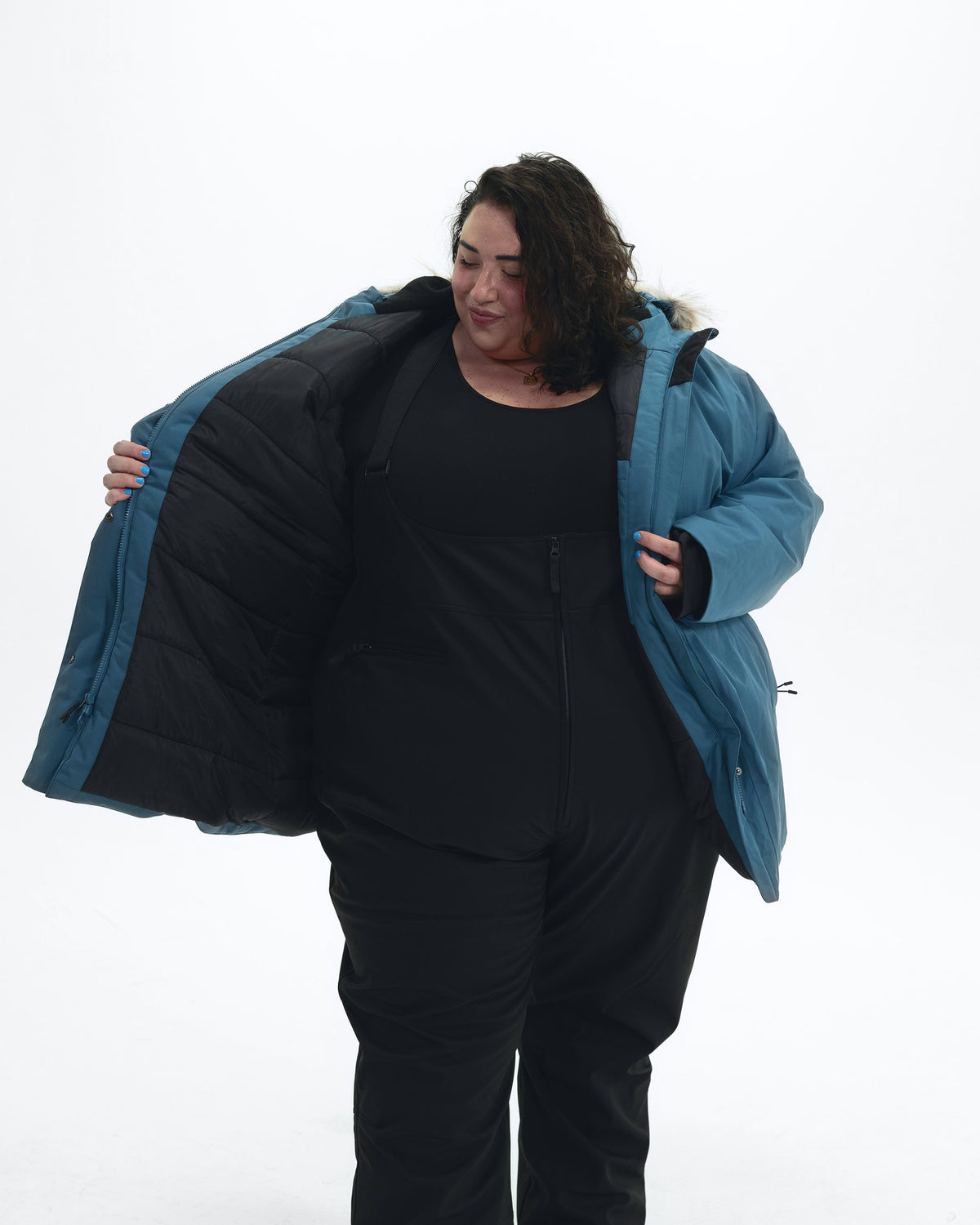 Peacock Cortina women's plus size insulated parka, worn open showing the quilted lining | Model is 5'4" and wears a 5X