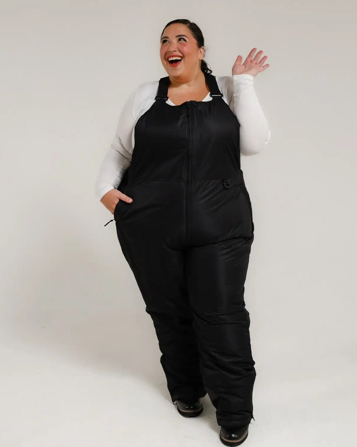 Black women's plus size Overland snow bibs, front, waving