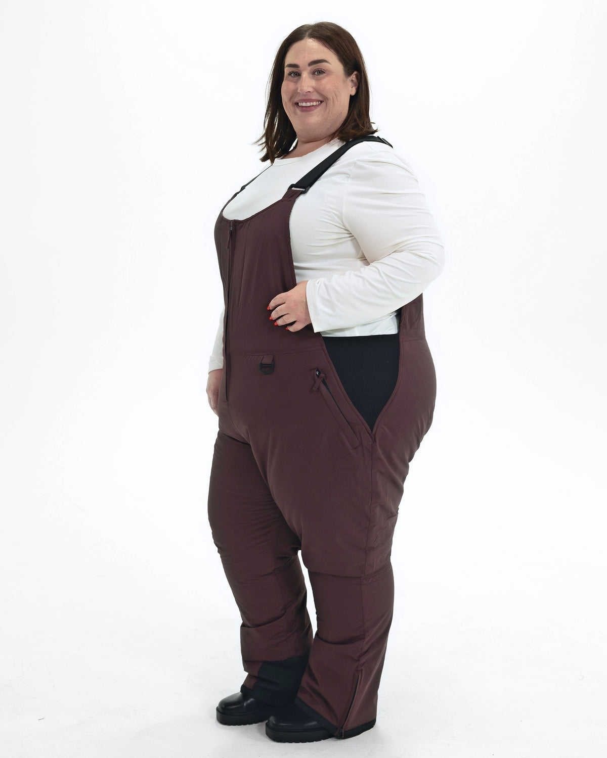 Eggplant women's plus size Overland snow bibs, front angle | Model is 5'4" and wears a 3X