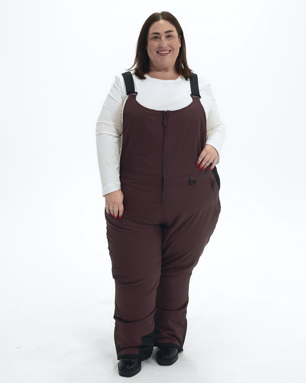 Eggplant women's plus size Overland snow bibs, front | Model is 5'4" and wears a 3X