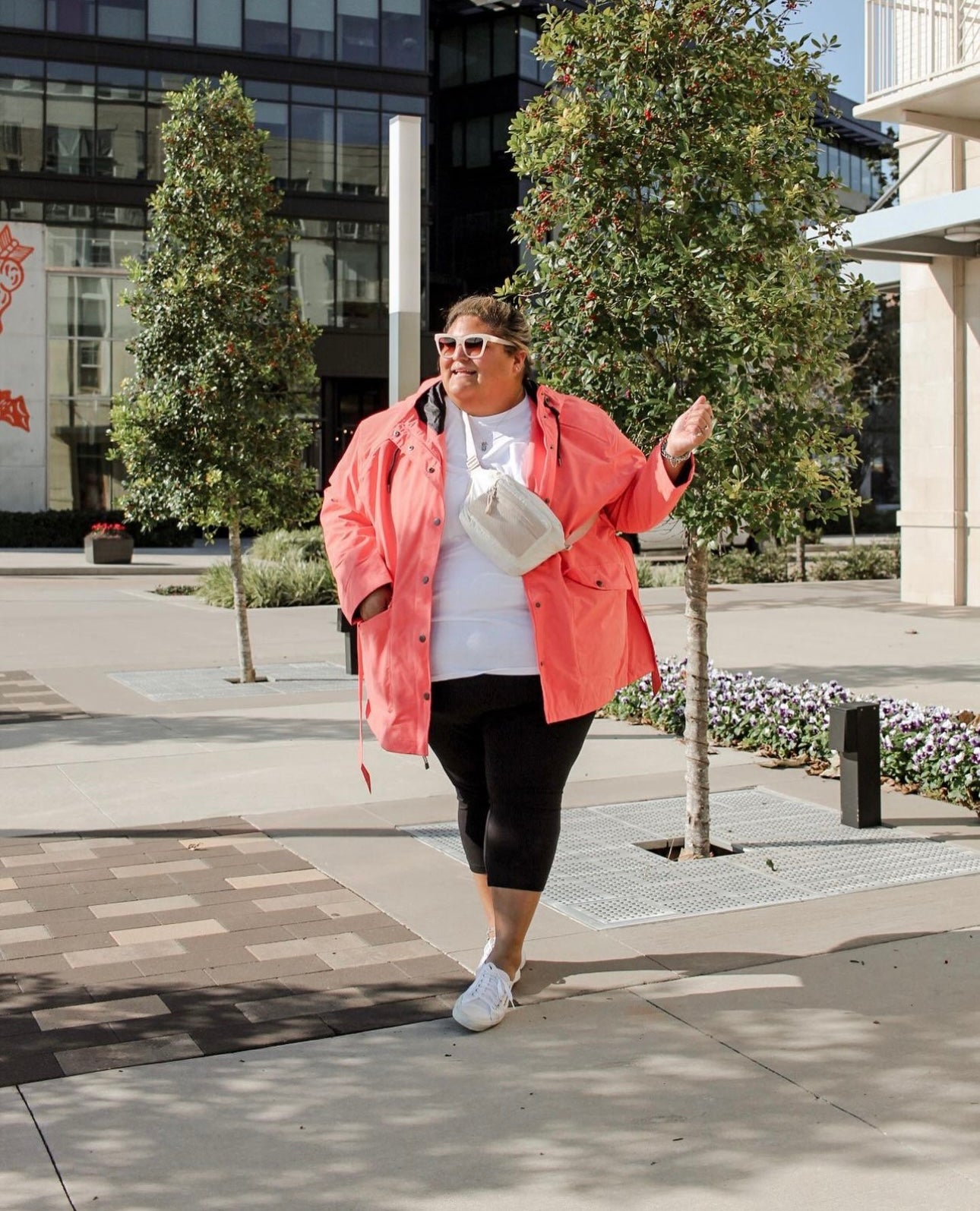Orange plus size rain jacket on a woman