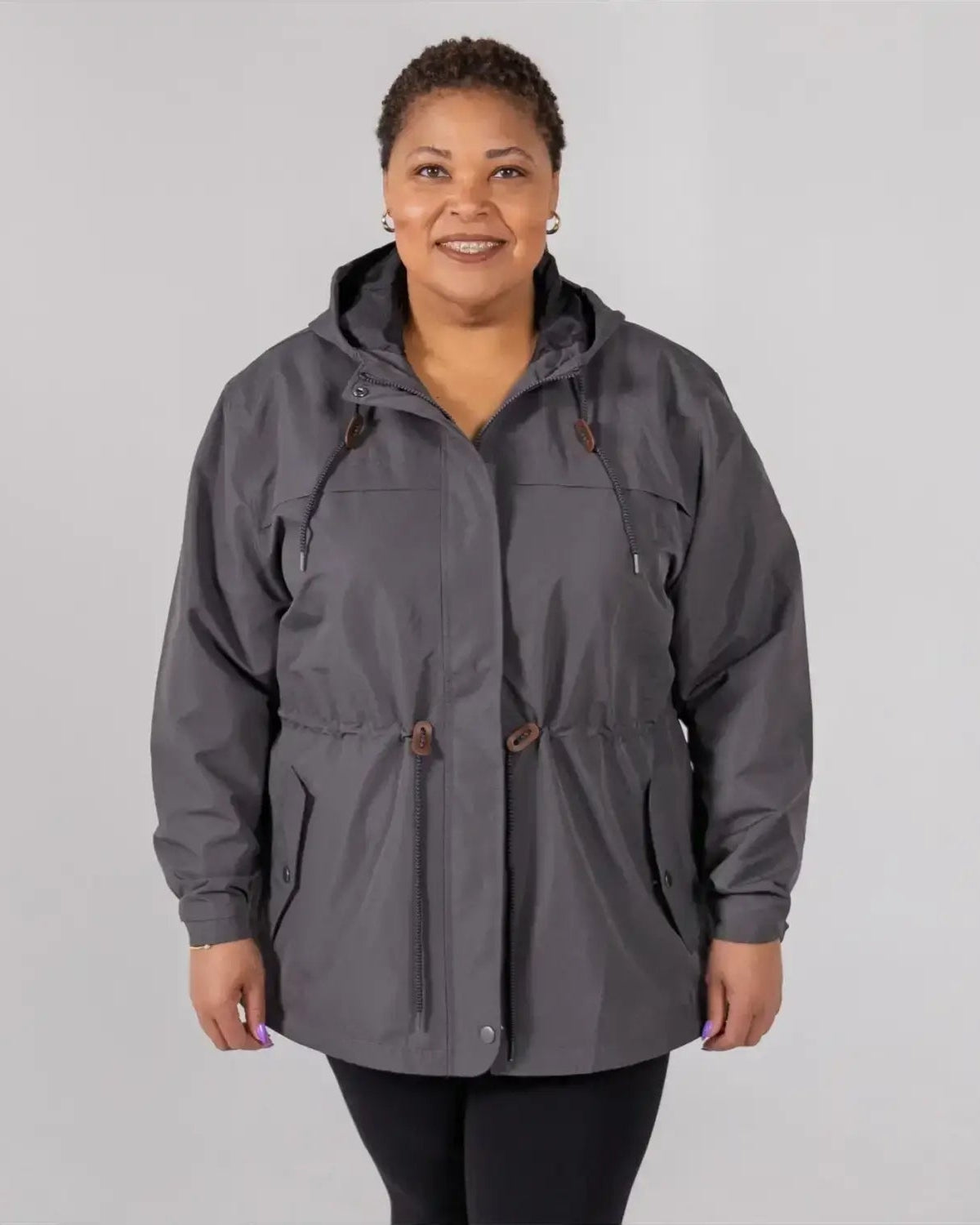 Gray plus size rain jacket on model, front image