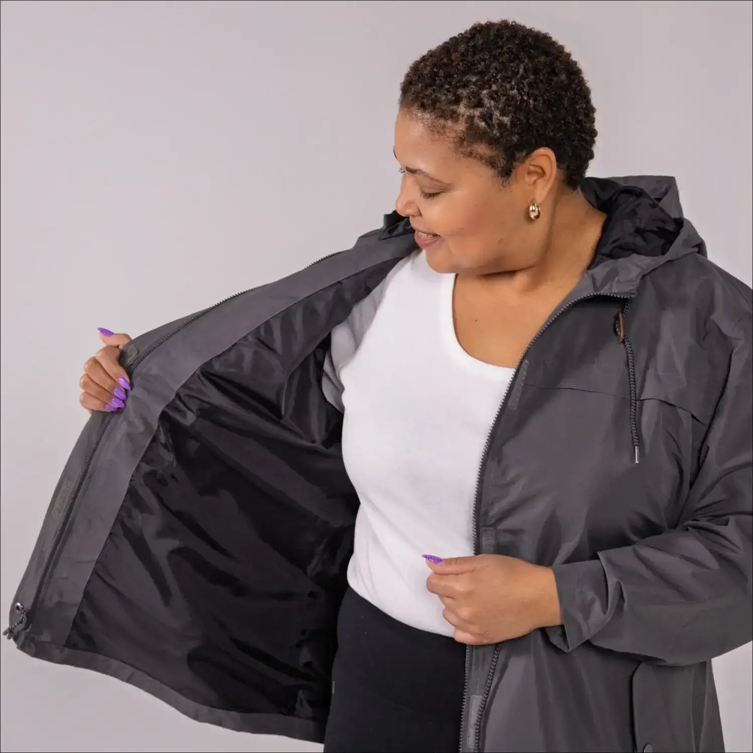 Gray plus size rain jacket on model, front image with inside showing