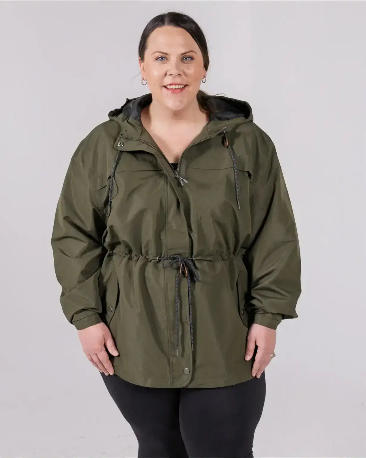 Green plus size rain jacket on model, front image