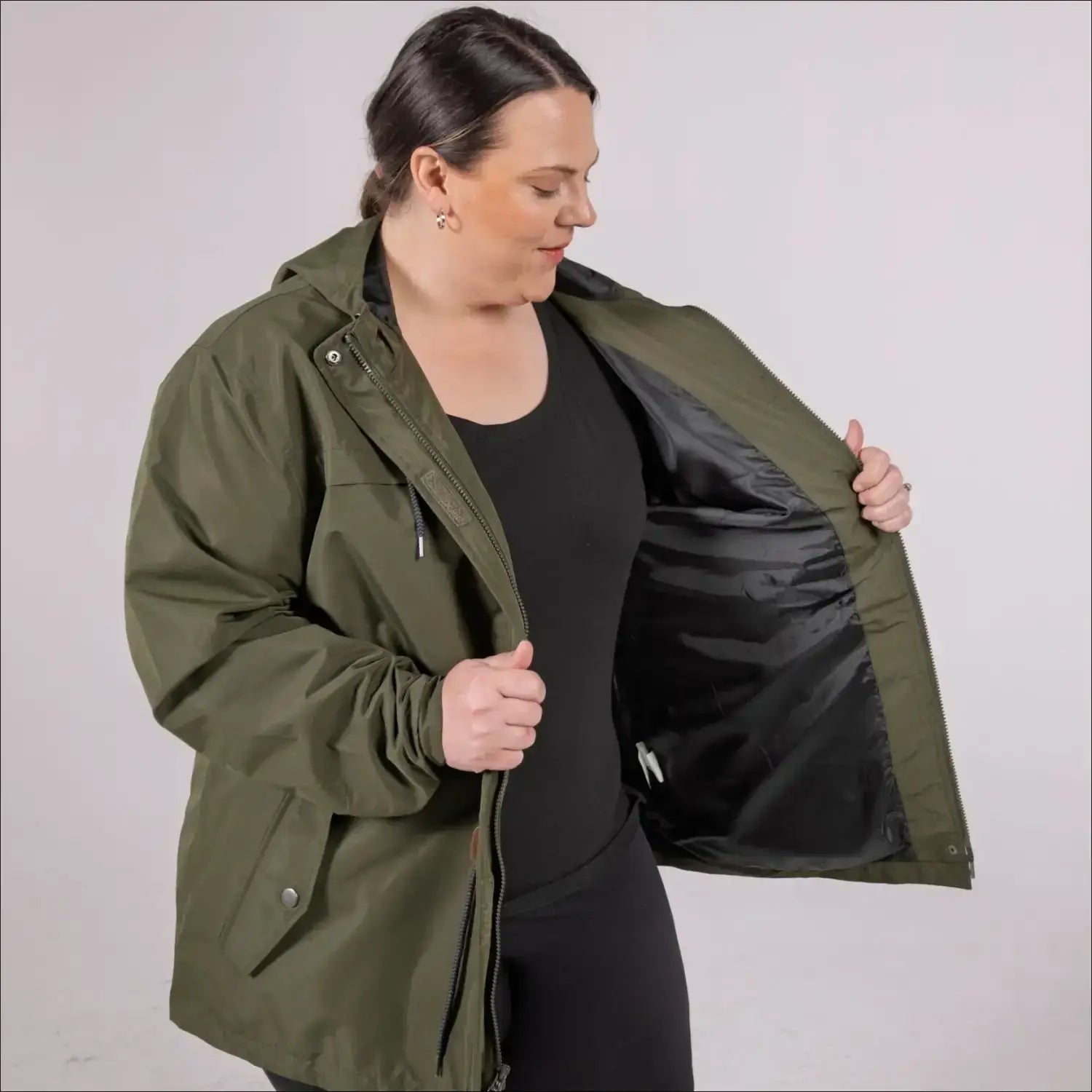 Green plus size rain jacket on model, front image with inside showing