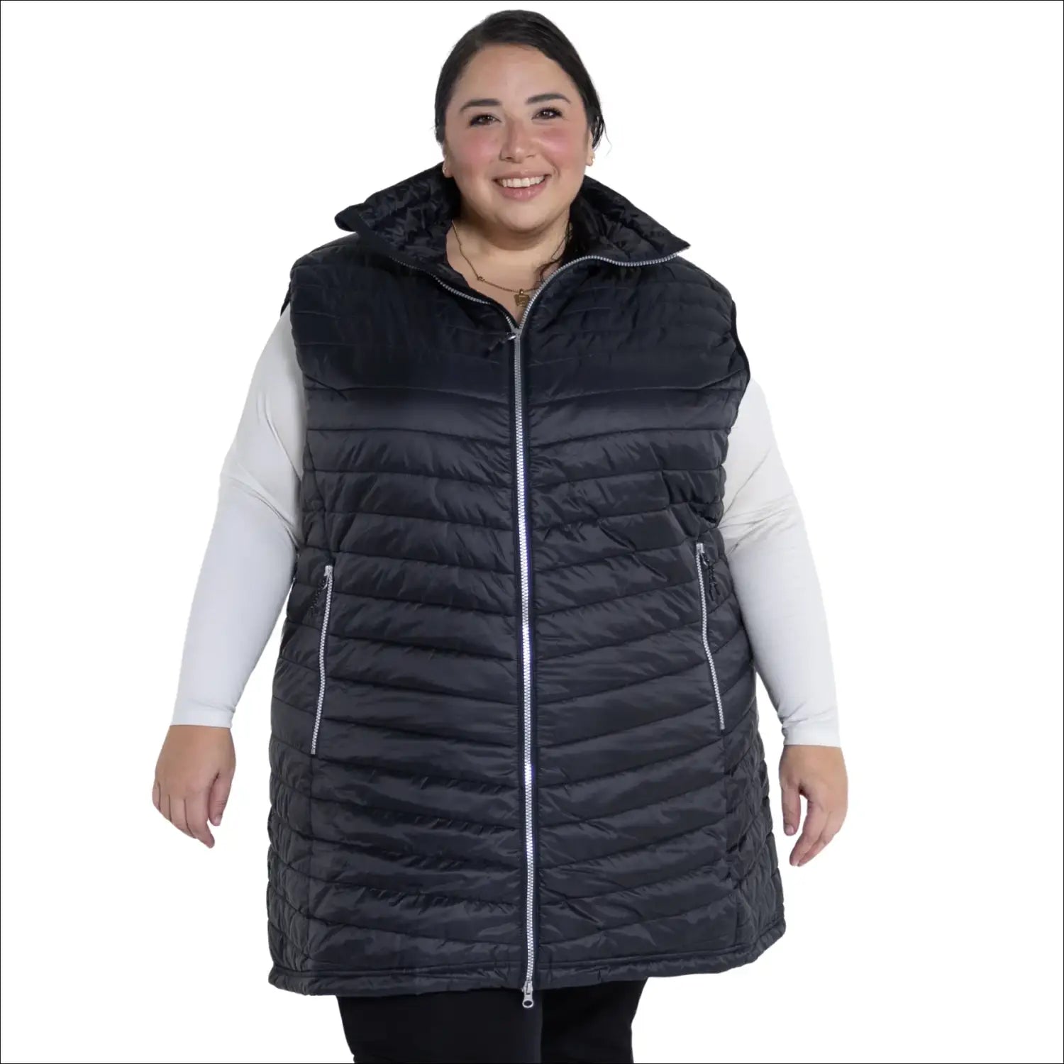 Woman wearing a black quilted insulated vest from Pristine Plus Size Outerwear collection