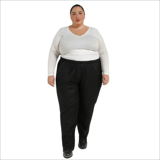 Plus size womens packable rain pants worn with a white long-sleeved shirt and black pants