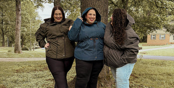 plus size rain jackets on a group of women outside