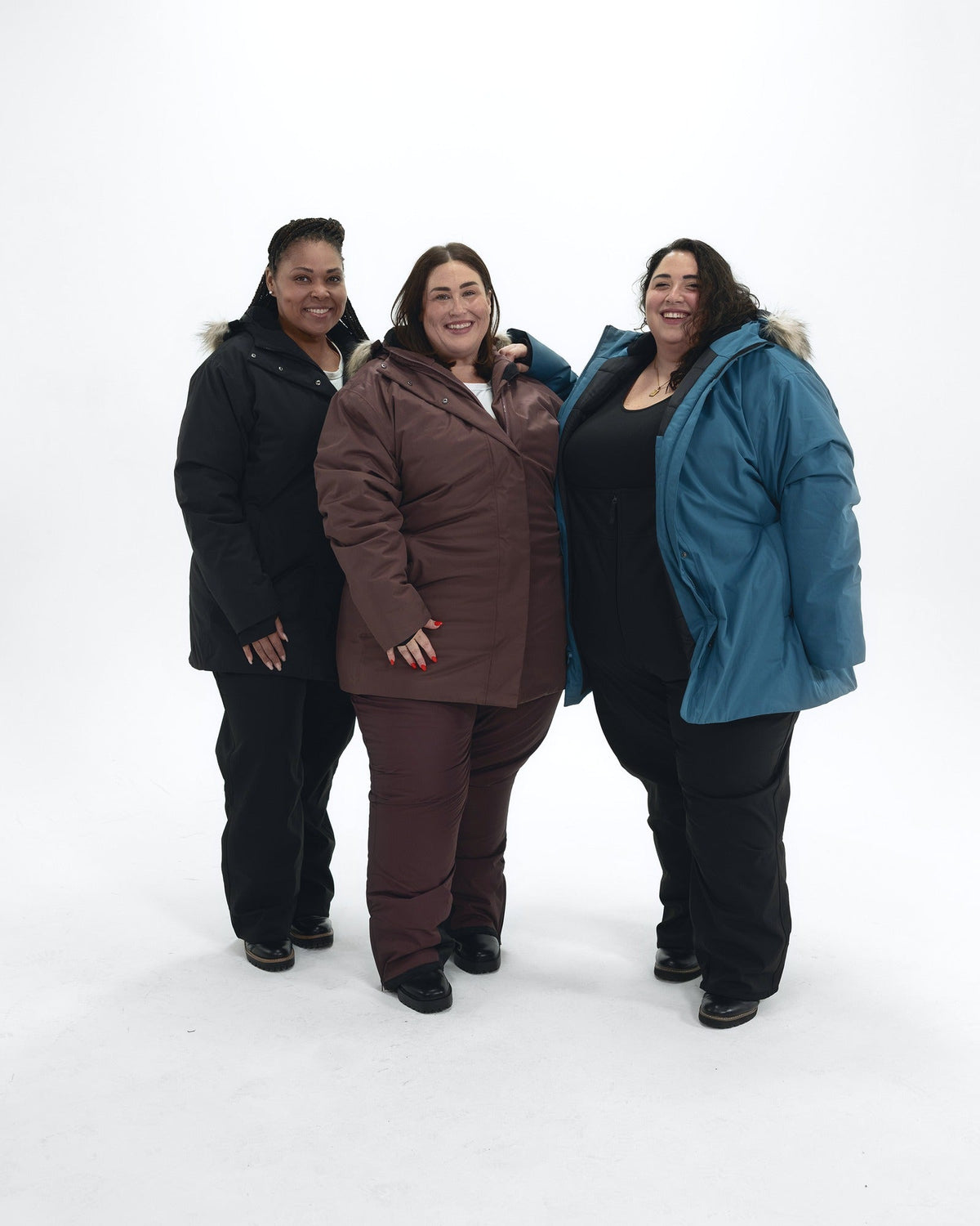 Cortina women's plus size insulated parka with faux fur hood, worn by three plus size models in Black, Peacock and Eggplant