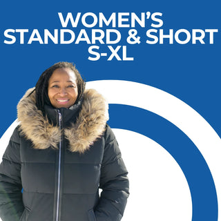 A girl standing on a mountain in a pair of petite short length snow pants