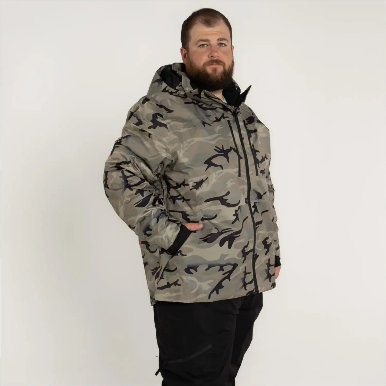 Camouflage hooded winter jacket featuring insulation and outdoor snow country design