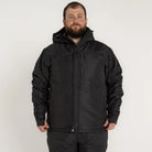 Man wearing black insulated winter snow ski jacket suitable for mountaineering and snow outdoor activities