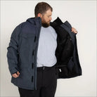 Man in a blue parka jacket from Snow Country Outerwear Men’s winter ski coat collection