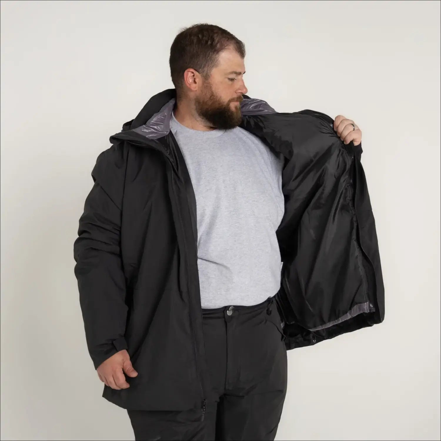 Man in black waterproof jacket from Men’s Big 2X-7X 3in1 Winter Ski Snow Jacket Coat Altitude II Snow Country Outerwear