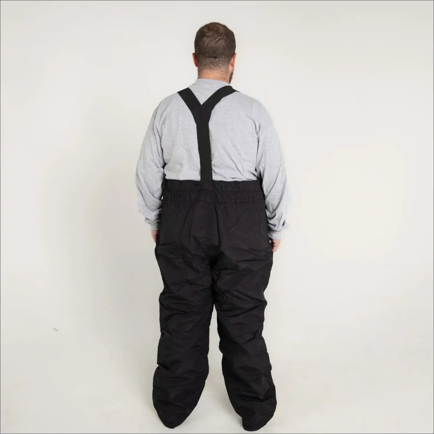 Black snow pants with suspenders from Snow Country Outerwear for big and tall men