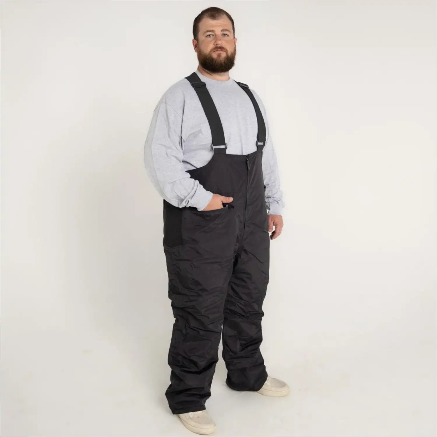 Black insulated bib overalls for skiing and snowboarding in men’s big and tall sizes