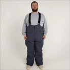 Man wearing gray Snow Country Outerwear insulated ski snow bibs with suspenders
